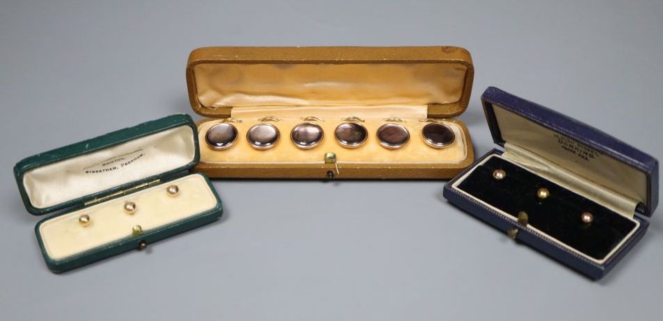 Six 9ct dress studs in two cases and one other cased set of six dress studs,